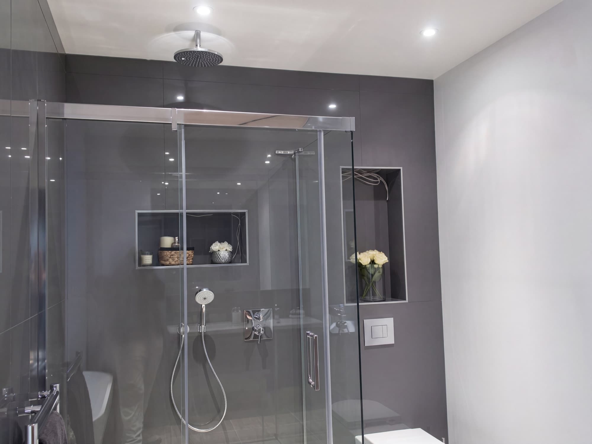Walk-in rainfall shower with illuminated niches, installed by InstaGasWorks
