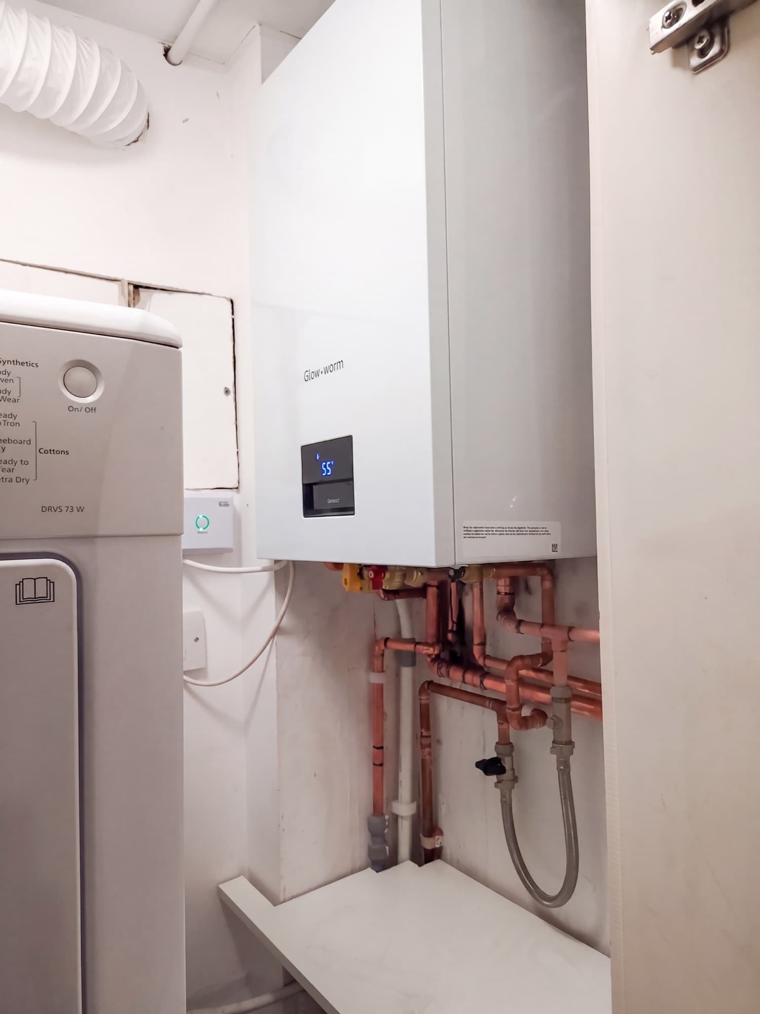 Glow-worm boiler installation in a cupboard