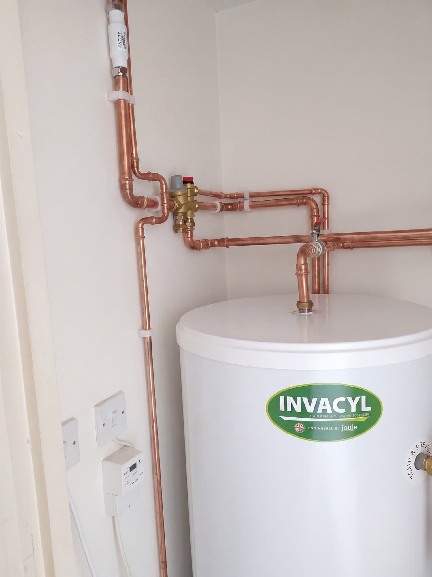 Unvented hot water cylinder with new copper pipework