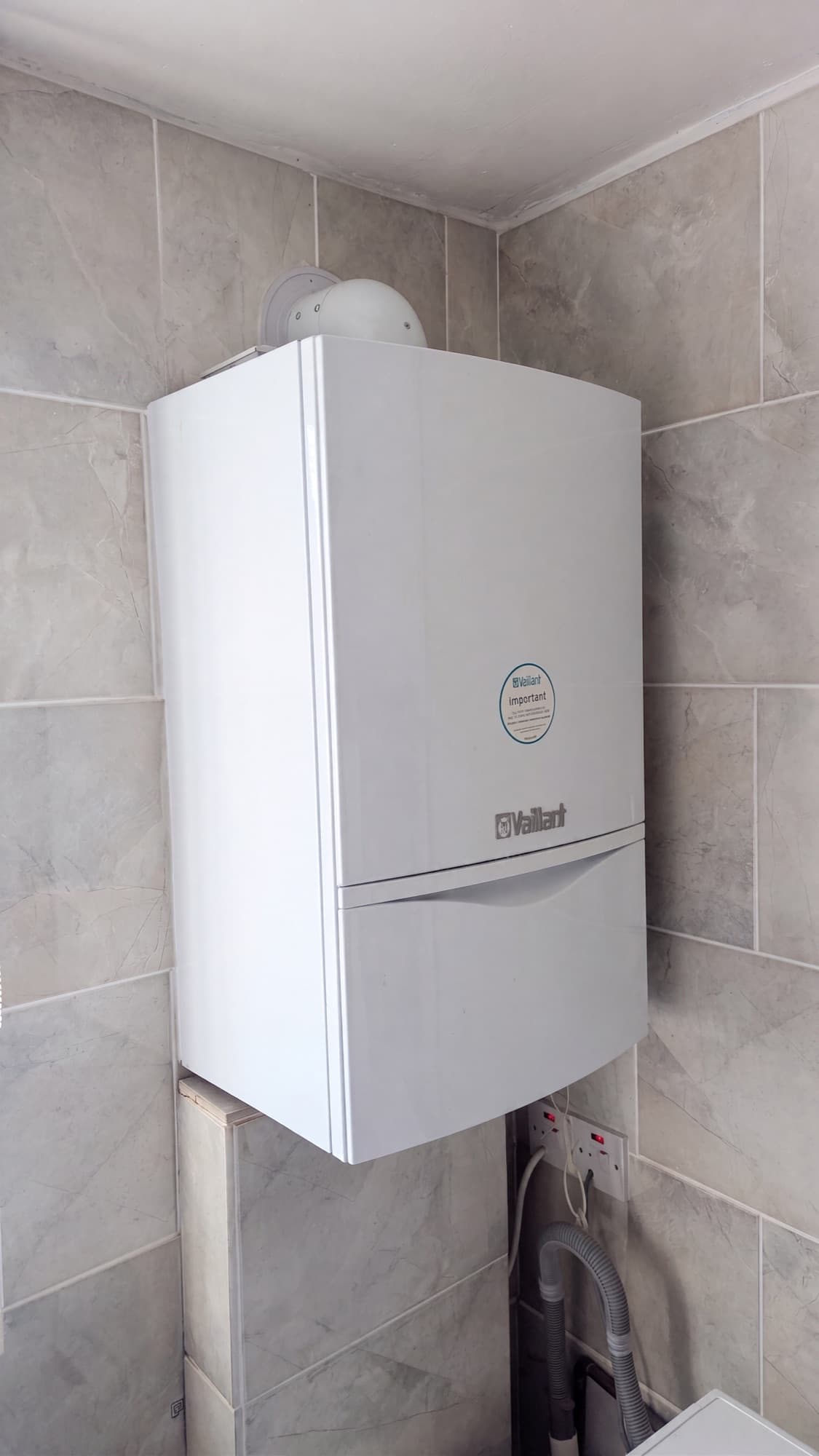 Vaillant boiler installed on a tiled wall