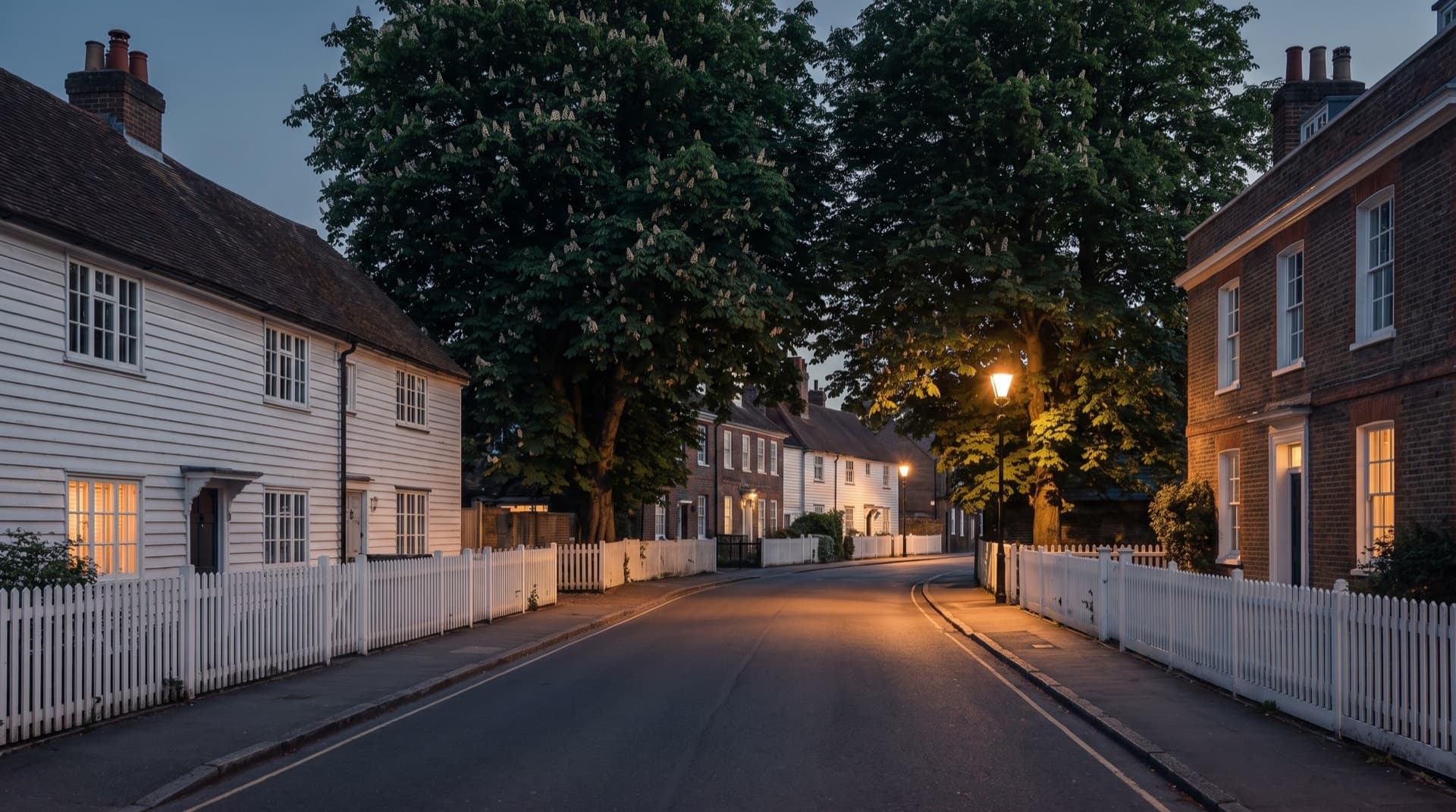 Georgian houses and picket fences in Dulwich Village at dusk
