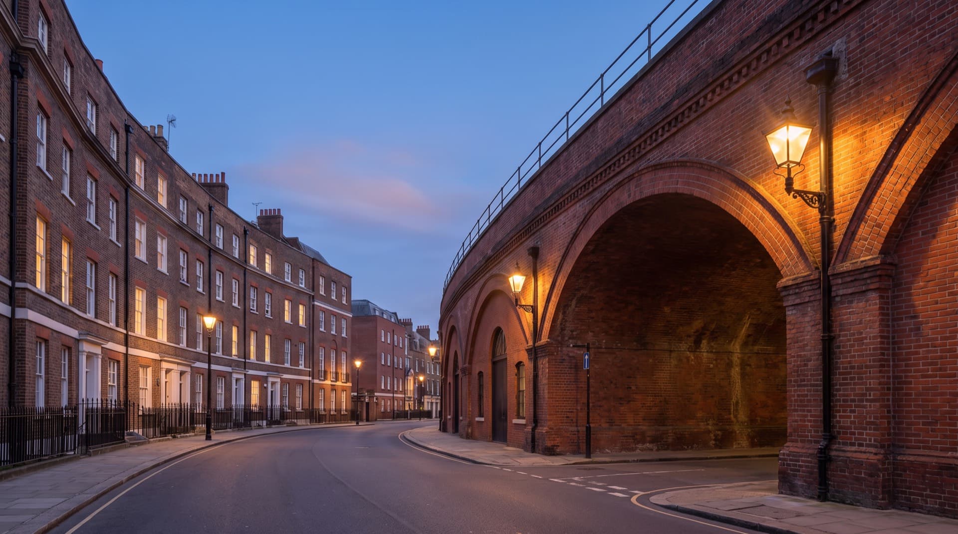 The railway bridge and Edwardian parade at Norbury in evening light