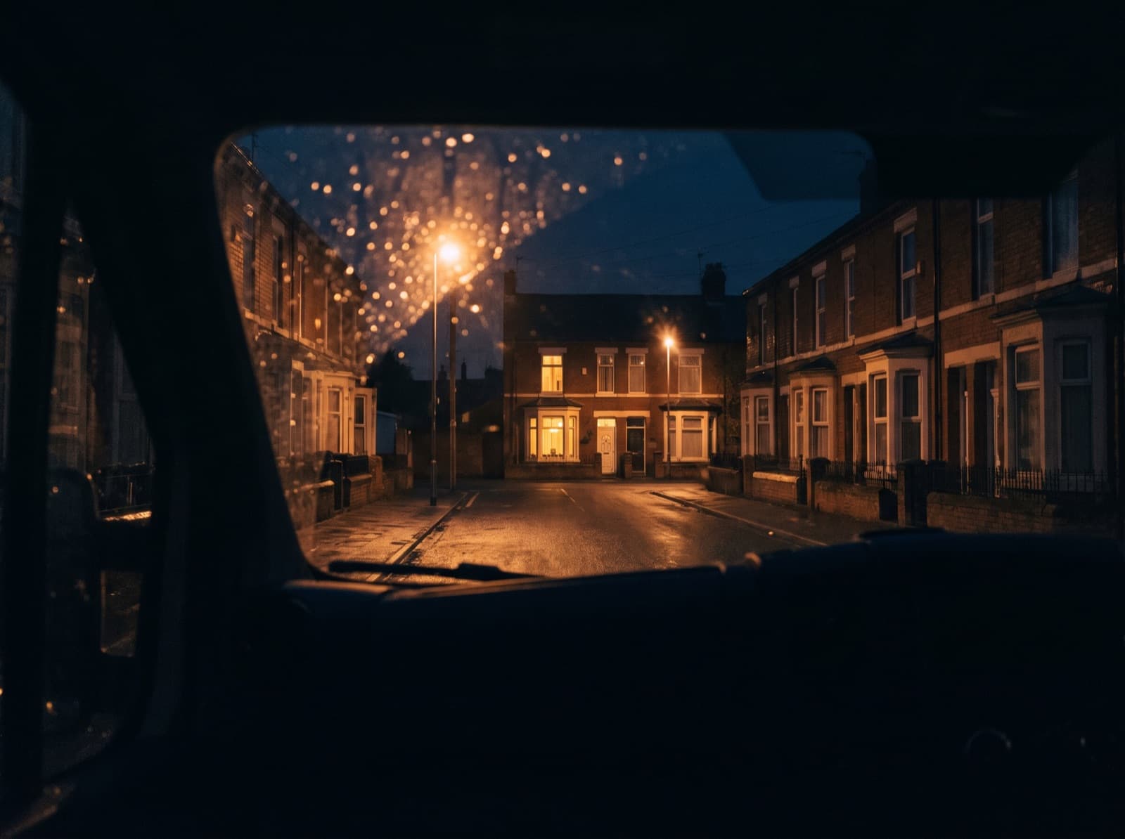 South London terraced street seen through a van windscreen on a rainy night